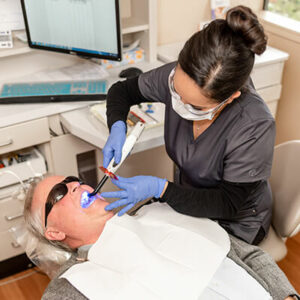 Dental-Care-Oral-Cancer-Screening-Checking by a dentist in Sumner