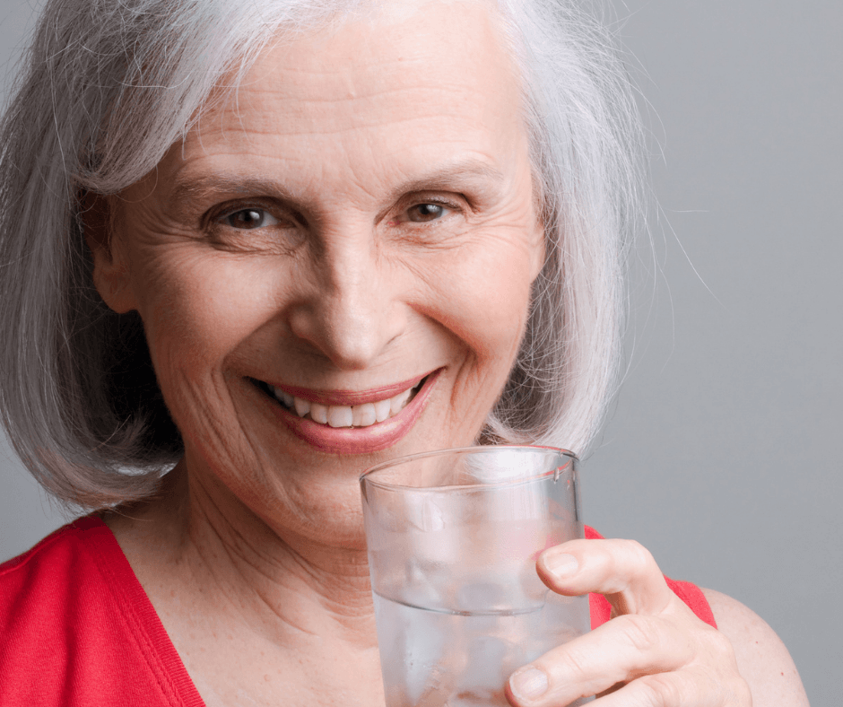 Older-Woman-Drinking-smiling